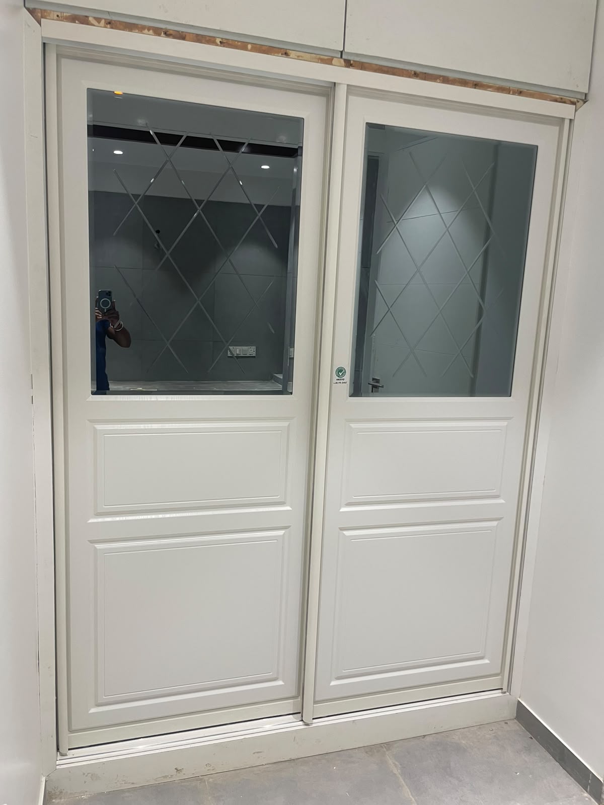 Aristo aluminium sliding wardrobe in Aurangabad with etched mirror and frosted glass shutters by More Than Kitchen
